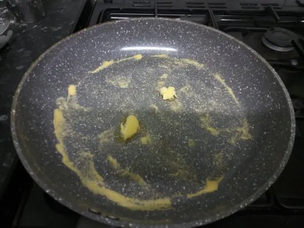 Cornmeal and butter in the pan